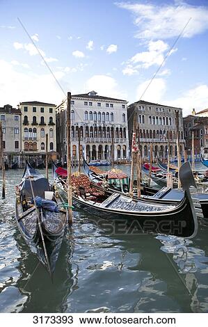 Stock Image - Gondolas at the pier, Venice, Italy . Fotosearch