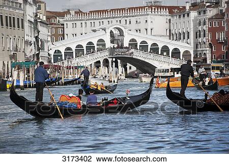 Gondolas on canal, bridge in the background, Venice, Italy View Large Photo Image Stock Image - Gondolas on canal, bridge in the background, Venice, Italy . Fotosearch