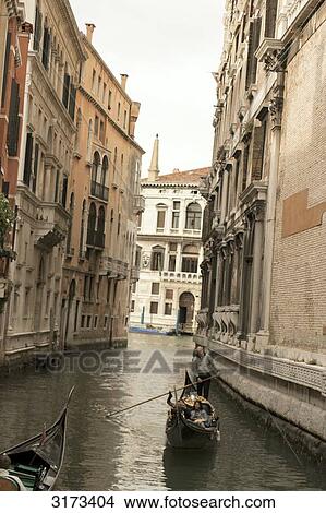 Picture - Gondolas on narrow canal, Venice, Italy, vanishing point . Fotosearch