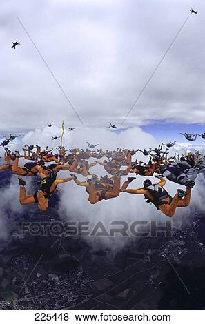 Stock Photo - Group of people parachuting in formation . Fotosearch