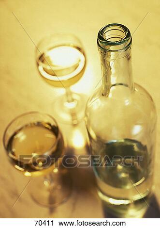 High angle view of bottle and glasses of white wine View Large Photo Image Stock Image - High angle view of bottle and glasses of white wine . Fotosearch