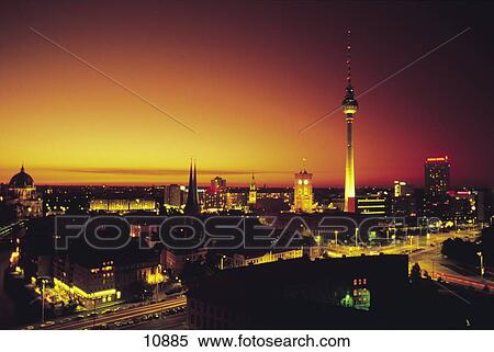 Stock Photography - High angle view of city lit up at sunset, Berlin, Germany . Fotosearch