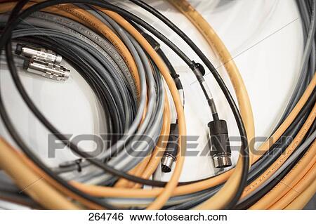 Stock Photograph - High angle view of coils of computer cables . Fotosearch