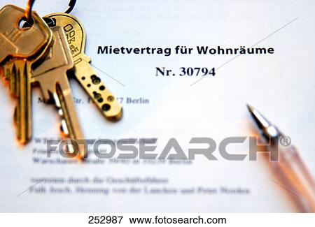Stock Photo - High angle view of keys and ballpoint pen on lease agreement . Fotosearch