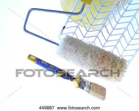 Stock Photo - High angle view of paint roller and brush . Fotosearch
