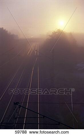 High angle view of railroad track at dawn View Large Photo Image Stock Photo - High angle view of railroad track at dawn . Fotosearch