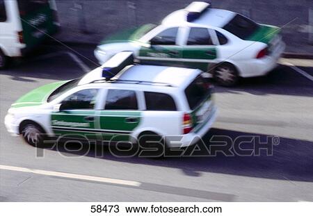 High angle view of two cars on road View Large Photo Image Stock Image - High angle view of two cars on road . Fotosearch