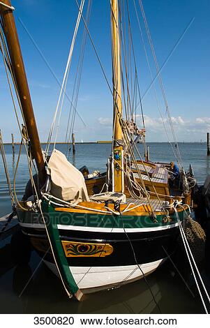 Historical sailing ship at the marina of Langeoog, Germany View Large Photo Image Stock Image - Historical sailing ship at the marina of Langeoog, Germany . Fotosearch