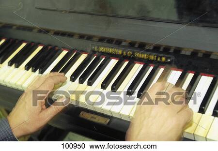 Human hands playing piano View Large Photo Image Stock Image - Human hands playing piano . Fotosearch