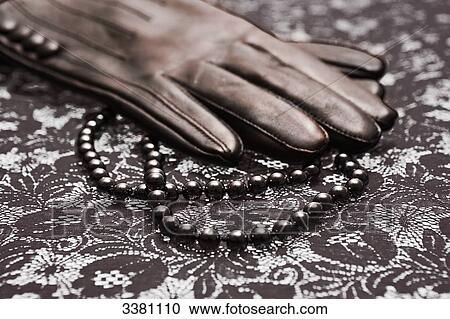 Leather glove and pearl necklace, close-up View Large Photo Image Stock Image - Leather glove and pearl necklace, close-up . Fotosearch