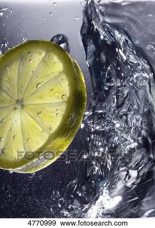 Stock Photo - Lemon slice in drink . Fotosearch