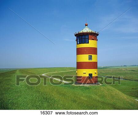 Stock Photo - Lighthouse in field, Ostfriesland, Germany . Fotosearch