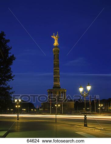 Picture - Lit up sculpture on column at night, The Gold Else, Siegessaeule, Grosser Stern, Berlin, Germany . Fotosearch