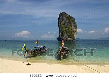 Longtail boats on the beach, Poda Island, Thailand View Large Photo Image Picture - Longtail boats on the beach, Poda Island, Thailand . Fotosearch