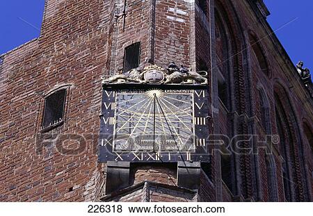 Low angle view of clock on brick wall View Large Photo Image Stock Photo - Low angle view of clock on brick wall . Fotosearch