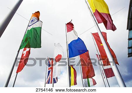 Low angle view of flags View Large Photo Image Stock Photograph - Low angle view of flags . Fotosearch