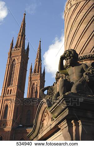 Stock Image - Low angle view of sculpture in front of church, Market Church, Wiesbaden, Germany . Fotosearch