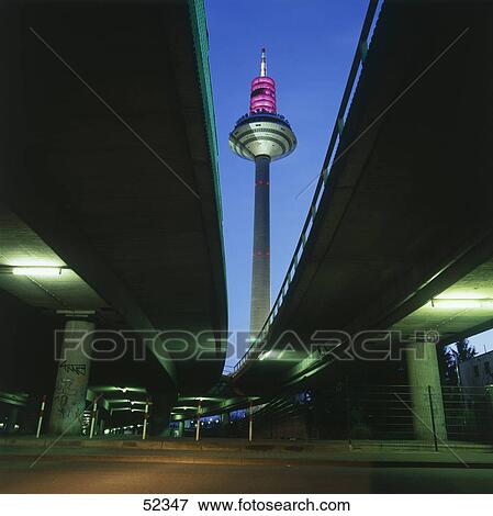 Low angle view of television tower lit up at dawn, Frankfurt, Germany View Large Photo Image Stock Photo - Low angle view of television tower lit up at dawn, Frankfurt, Germany . Fotosearch