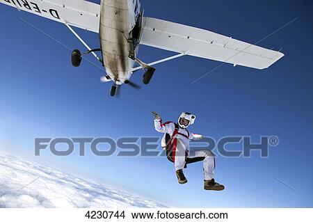 Picture - Male parachute jumper, Illertissen, Bavaria, Germany, Europe . Fotosearch