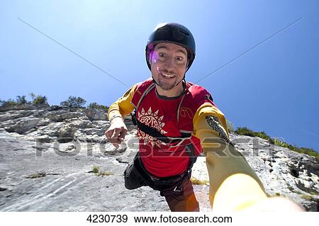 Stock Photo - Male parachute jumper, Lauterbrunnen, Canton Bern, Switzerland . Fotosearch