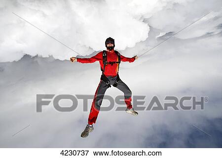 Male parachute jumper, Saanen, Canton Bern, Switzerland View Large Photo Image Stock Photo - Male parachute jumper, Saanen, Canton Bern, Switzerland . Fotosearch
