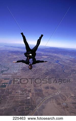 Stock Image - Man free falling headfirst . Fotosearch
