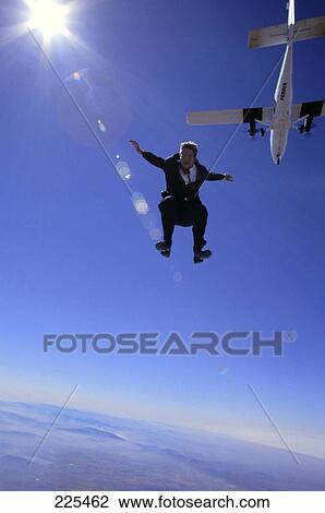 Man free falling, low angle view View Large Photo Image Stock Image - Man free falling, low angle view . Fotosearch