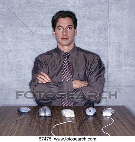 Man sitting in front of computer mice View Large Photo Image Stock Photography - Man sitting in front of computer mice . Fotosearch