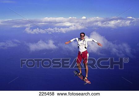 Stock Photo - Man skydiving on skateboard . Fotosearch