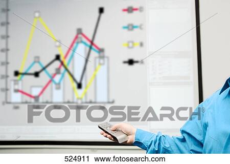 Man's hand holding remote with projection screen in background View Large Photo Image Stock Image - Man's hand holding remote with projection screen in background . Fotosearch