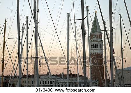 Masts in front of tower at dim, Venice, Italy, silhouette View Large Photo Image Stock Photo - Masts in front of tower at dim, Venice, Italy, silhouette . Fotosearch
