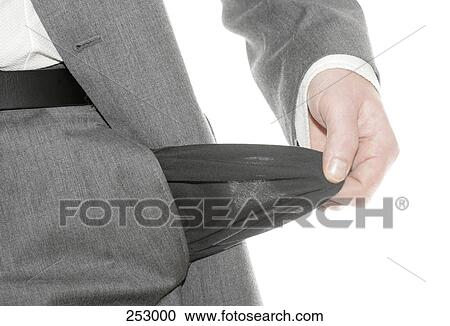 Stock Image - Mid section view of man showing his empty pocket . Fotosearch