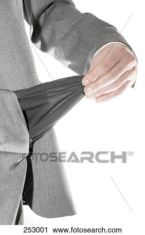 Stock Image - Mid section view of man showing his empty pocket . Fotosearch
