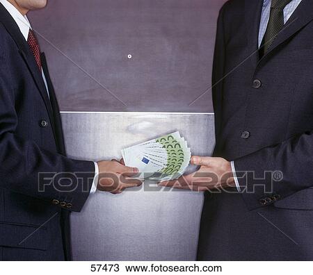 Mid section view of two businessmen exchanging money View Large Photo Image Stock Image - Mid section view of two businessmen exchanging money . Fotosearch