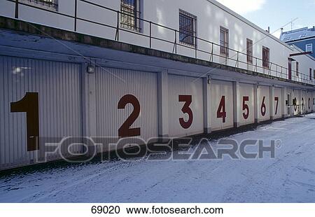 Stock Image - Numbers printed on garage shutters . Fotosearch