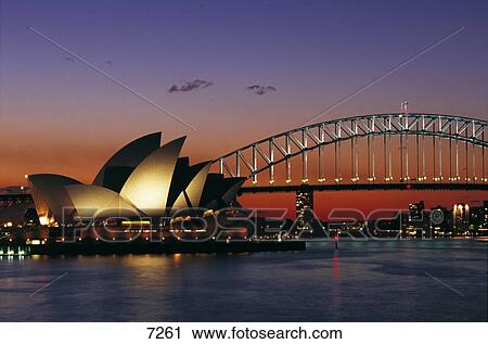 Stock Image - Opera house lit up at sunset, Sydney Harbor Bridge, Sydney Opera House, Sydney, New South Wales, Australia . Fotosearch