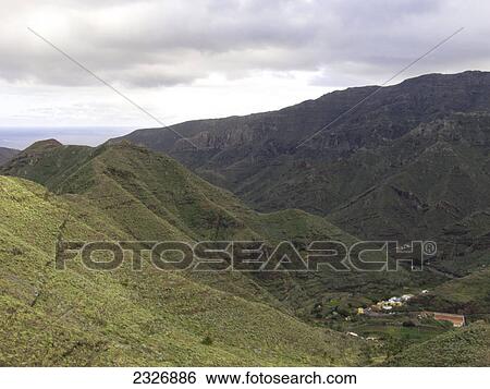 Overcast sky over mountain range, La Gomera, Canary Islands, Spain View Large Photo Image Stock Photograph - Overcast sky over mountain range, La Gomera, Canary Islands, Spain . Fotosearch