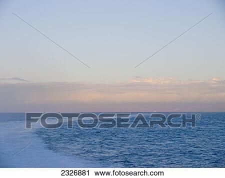 Panoramic view of sea at dusk, Canary Islands, Spain View Large Photo Image Stock Image - Panoramic view of sea at dusk, Canary Islands, Spain . Fotosearch