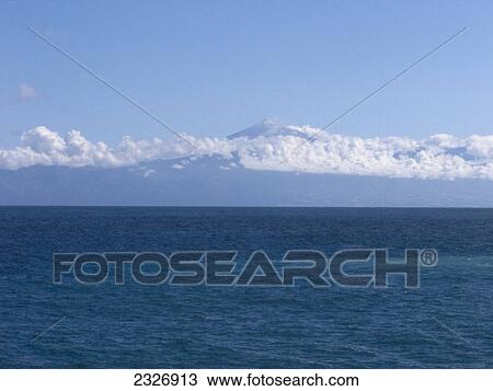 Panoramic view of seascape in front of mountain, Tenerife, Canary Islands, Spain View Large Photo Image Stock Image - Panoramic view of seascape in front of mountain, Tenerife, Canary Islands, Spain . Fotosearch