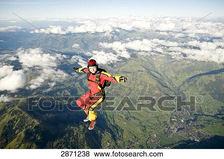 Stock Photo - parachute jumper, full shot . Fotosearch