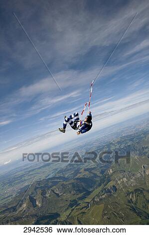 Stock Photograph - parachute jumper, full shot . Fotosearch