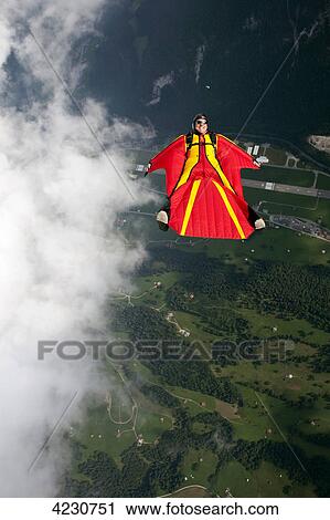 Parachute jumper with wingsuit, Saanen, Canton Bern, Switzerland View Large Photo Image Stock Image - Parachute jumper with wingsuit, Saanen, Canton Bern, Switzerland . Fotosearch