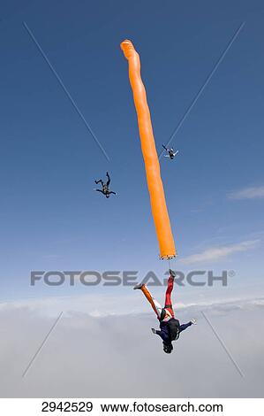 parachute jumping, full shot View Large Photo Image Stock Photo - parachute jumping, full shot . Fotosearch