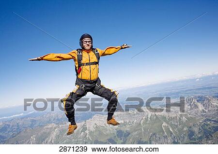 Parachutist in free fall, Switzerland View Large Photo Image Stock Photo - Parachutist in free fall, Switzerland . Fotosearch