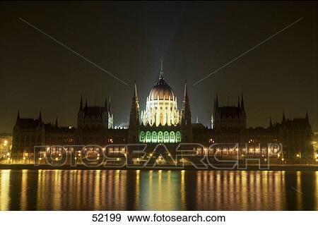 Stock Photo - Parliament building lit up at night, Danube River, Budapest, Hungary . Fotosearch
