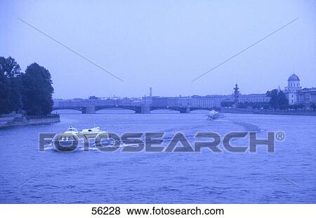 Passenger boats traveling in river water, St. Petersburg, Russia View Large Photo Image Stock Photo - Passenger boats traveling in river water, St. Petersburg, Russia . Fotosearch