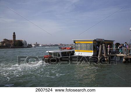 Picture - Passengers walking on pier, Isola Murano, Veneto, Venice, Italy . Fotosearch