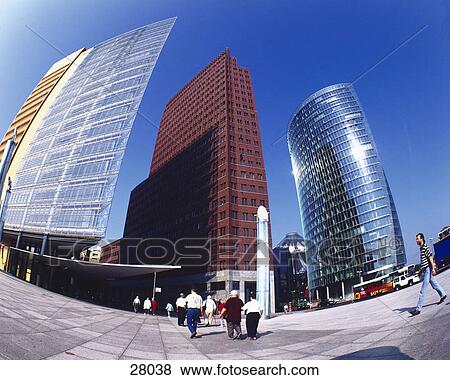 Stock Photo - People in front of buildings in city . Fotosearch