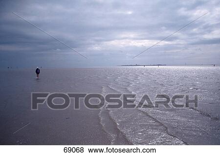 Person walking on beach View Large Photo Image Stock Photo - Person walking on beach . Fotosearch