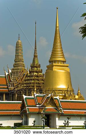 Stock Image - Phra Sri Rattana Chedi in King's Palace Wat Phra Kaeo, Bangkok, Thailand . Fotosearch